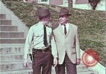 Image of police car rural road United States USA, 1964, second 29 stock footage video 65675078748