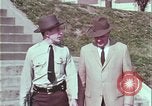 Image of police car rural road United States USA, 1964, second 31 stock footage video 65675078748