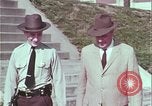 Image of police car rural road United States USA, 1964, second 32 stock footage video 65675078748