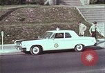 Image of police car rural road United States USA, 1964, second 38 stock footage video 65675078748