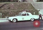 Image of police car rural road United States USA, 1964, second 40 stock footage video 65675078748