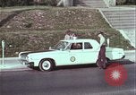 Image of police car rural road United States USA, 1964, second 41 stock footage video 65675078748