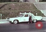 Image of police car rural road United States USA, 1964, second 43 stock footage video 65675078748