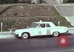 Image of police car rural road United States USA, 1964, second 45 stock footage video 65675078748