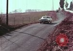 Image of police car rural road United States USA, 1964, second 48 stock footage video 65675078748