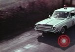 Image of police car rural road United States USA, 1964, second 50 stock footage video 65675078748
