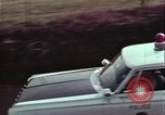 Image of police car rural road United States USA, 1964, second 51 stock footage video 65675078748