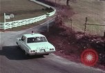 Image of police car rural road United States USA, 1964, second 53 stock footage video 65675078748