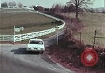 Image of police car rural road United States USA, 1964, second 54 stock footage video 65675078748