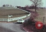 Image of police car rural road United States USA, 1964, second 55 stock footage video 65675078748
