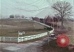 Image of police car rural road United States USA, 1964, second 58 stock footage video 65675078748