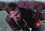 Image of criminals arrested motel stakeout United States USA, 1964, second 25 stock footage video 65675078749
