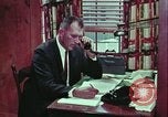 Image of criminals arrested motel stakeout United States USA, 1964, second 34 stock footage video 65675078749