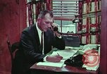 Image of criminals arrested motel stakeout United States USA, 1964, second 35 stock footage video 65675078749