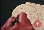 Image of detective gather crime evidence United States USA, 1970, second 13 stock footage video 65675078755