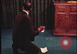 Image of detective gather crime evidence United States USA, 1970, second 15 stock footage video 65675078755