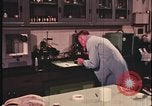 Image of detective gather crime evidence United States USA, 1970, second 28 stock footage video 65675078755