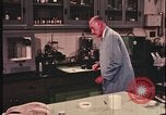 Image of detective gather crime evidence United States USA, 1970, second 29 stock footage video 65675078755