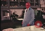Image of detective gather crime evidence United States USA, 1970, second 30 stock footage video 65675078755