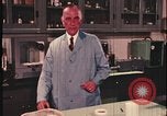 Image of detective gather crime evidence United States USA, 1970, second 31 stock footage video 65675078755
