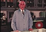 Image of detective gather crime evidence United States USA, 1970, second 33 stock footage video 65675078755