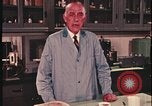 Image of detective gather crime evidence United States USA, 1970, second 47 stock footage video 65675078755