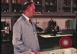 Image of detective gather crime evidence United States USA, 1970, second 55 stock footage video 65675078755