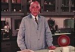Image of detective gather crime evidence United States USA, 1970, second 62 stock footage video 65675078755