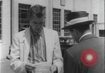 Image of car dealer alerts FBI stolen automobile Maryland United States USA, 1956, second 25 stock footage video 65675078757