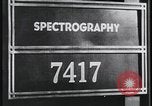 Image of FBI technicians view forensic evidence with microscopes United States USA, 1959, second 1 stock footage video 65675078761