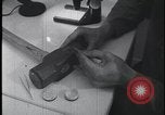 Image of FBI technicians view forensic evidence with microscopes United States USA, 1959, second 3 stock footage video 65675078761