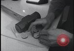 Image of FBI technicians view forensic evidence with microscopes United States USA, 1959, second 7 stock footage video 65675078761