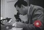 Image of FBI technicians view forensic evidence with microscopes United States USA, 1959, second 12 stock footage video 65675078761