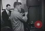 Image of FBI technicians view forensic evidence with microscopes United States USA, 1959, second 27 stock footage video 65675078761