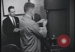 Image of FBI technicians view forensic evidence with microscopes United States USA, 1959, second 28 stock footage video 65675078761