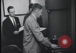 Image of FBI technicians view forensic evidence with microscopes United States USA, 1959, second 30 stock footage video 65675078761