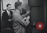 Image of FBI technicians view forensic evidence with microscopes United States USA, 1959, second 32 stock footage video 65675078761