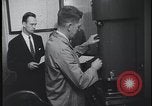 Image of FBI technicians view forensic evidence with microscopes United States USA, 1959, second 33 stock footage video 65675078761