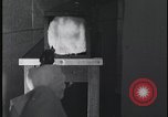 Image of FBI technicians view forensic evidence with microscopes United States USA, 1959, second 54 stock footage video 65675078761