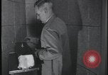 Image of FBI technicians view forensic evidence with microscopes United States USA, 1959, second 61 stock footage video 65675078761