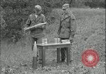 Image of 105mm HE smoke shell leaflet replacement Fort Riley Kansas USA, 1951, second 7 stock footage video 65675078828
