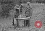 Image of 105mm HE smoke shell leaflet replacement Fort Riley Kansas USA, 1951, second 9 stock footage video 65675078828