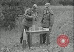 Image of 105mm HE smoke shell leaflet replacement Fort Riley Kansas USA, 1951, second 10 stock footage video 65675078828