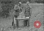 Image of 105mm HE smoke shell leaflet replacement Fort Riley Kansas USA, 1951, second 11 stock footage video 65675078828