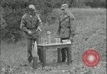 Image of 105mm HE smoke shell leaflet replacement Fort Riley Kansas USA, 1951, second 13 stock footage video 65675078828
