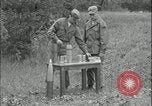 Image of 105mm HE smoke shell leaflet replacement Fort Riley Kansas USA, 1951, second 14 stock footage video 65675078828