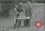Image of 105mm HE smoke shell leaflet replacement Fort Riley Kansas USA, 1951, second 17 stock footage video 65675078828