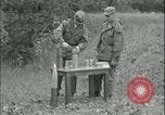 Image of 105mm HE smoke shell leaflet replacement Fort Riley Kansas USA, 1951, second 18 stock footage video 65675078828