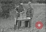 Image of 105mm HE smoke shell leaflet replacement Fort Riley Kansas USA, 1951, second 19 stock footage video 65675078828