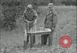Image of 105mm HE smoke shell leaflet replacement Fort Riley Kansas USA, 1951, second 22 stock footage video 65675078828